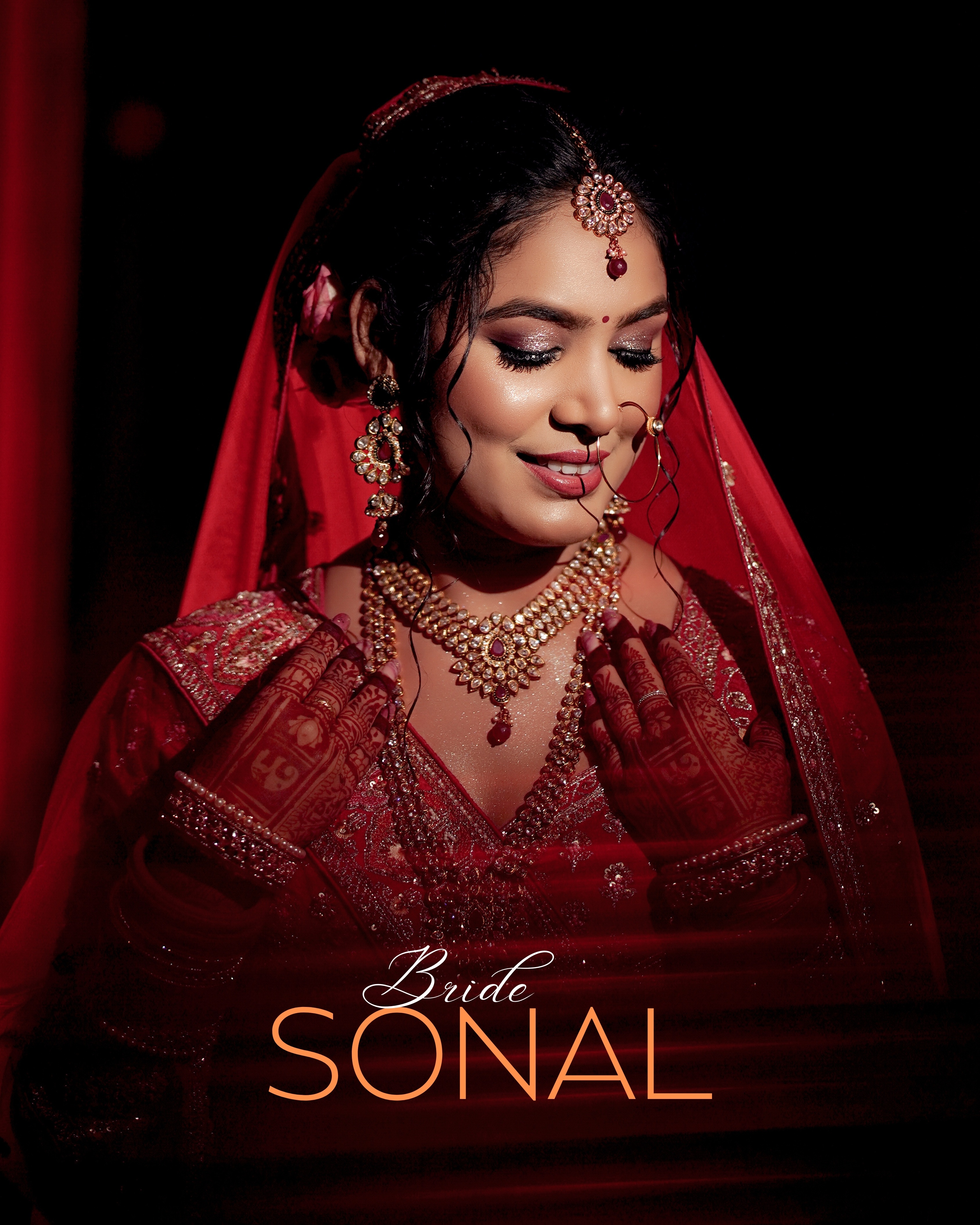 ZigpicS signature bridal portrait — bride in red lehenga with gold jewellery, Muzaffarpur